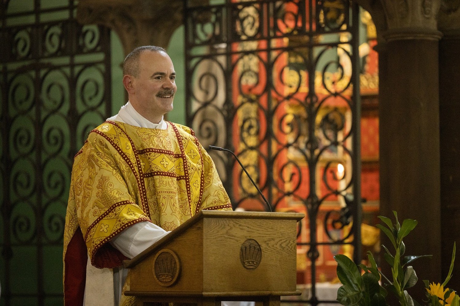 rector speaking at lectern